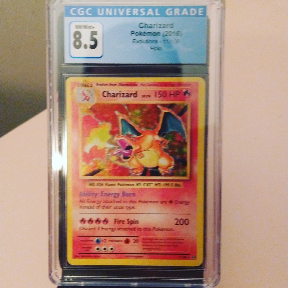 2016 cgc 8.5 Charizard holo from evolutions